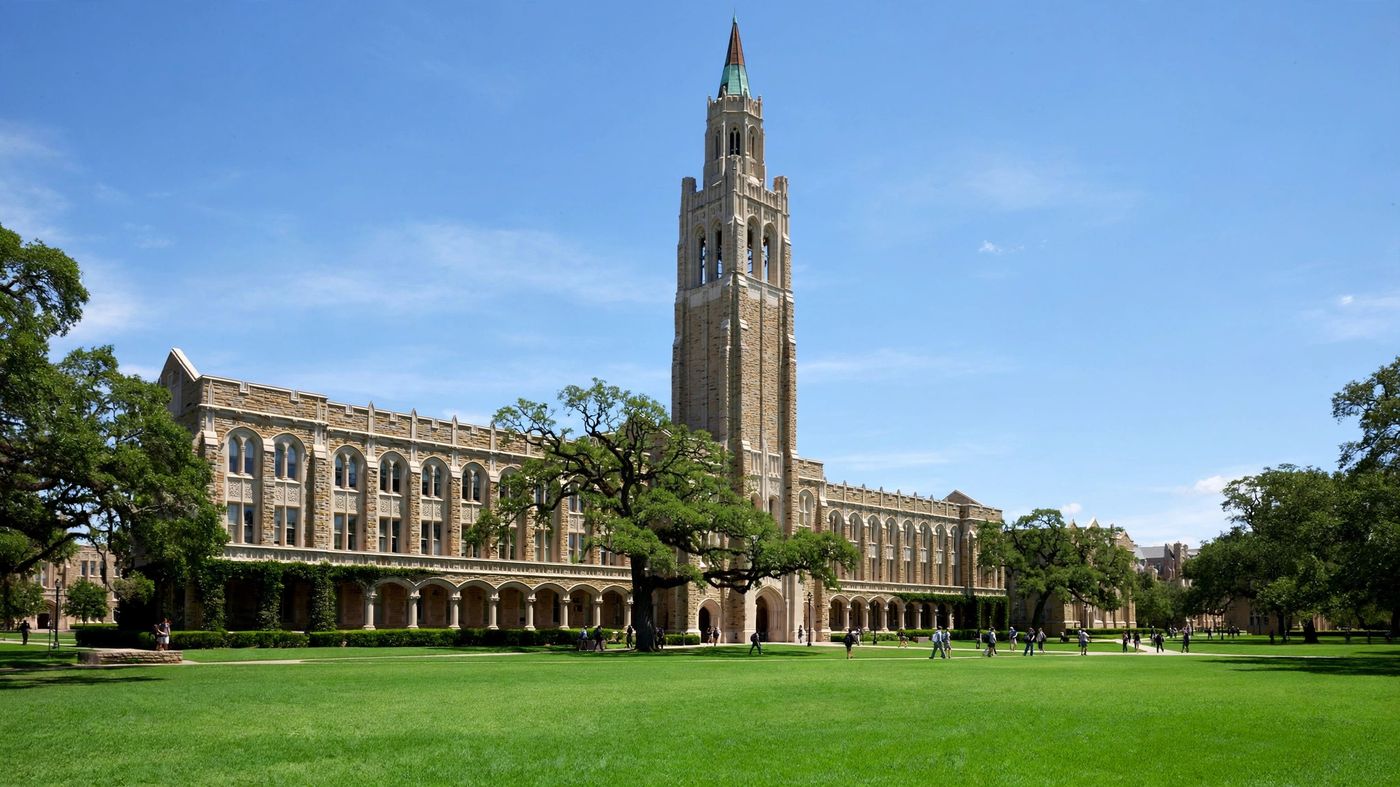 A university campus building under a bright sky